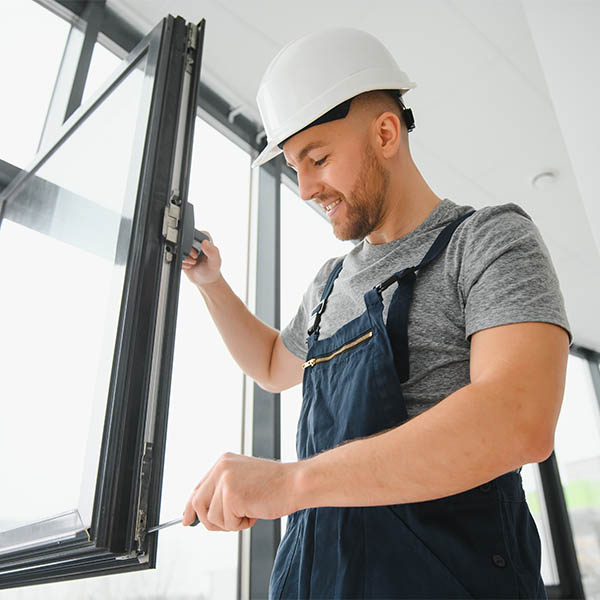 photo of a builder installing a pvc window